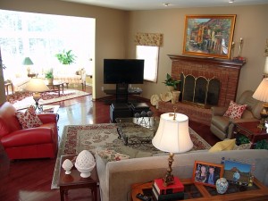 sun fam after By moving the TV next to the fireplace, we created a combined focal point. Angling the furniture created interest and movement in the square space.